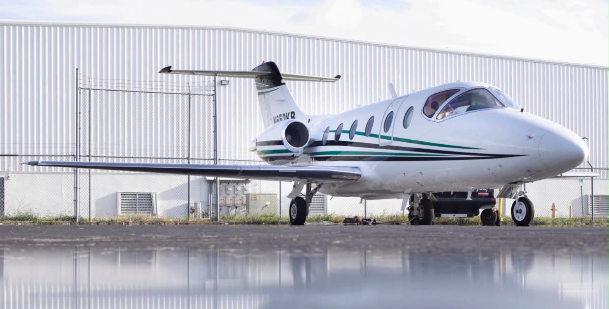 Private jet on tarmac at dusk